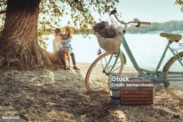 A Spontaneous Picnic For Two Stock Photo - Download Image Now - Picnic, Bicycle, Couple - Relationship