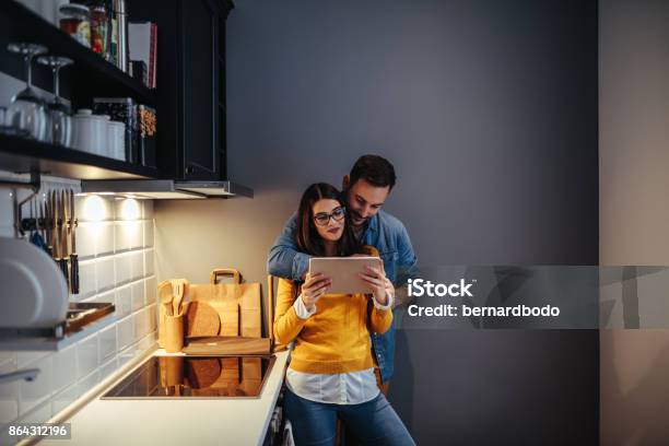 What Do You Feel Like Ordering Stock Photo - Download Image Now - Couple - Relationship, Digital Tablet, Domestic Life