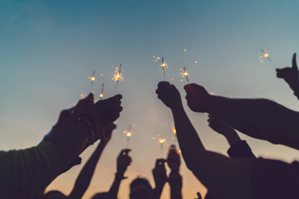 istock Friends celebrating New Year on the rooftop 864312400