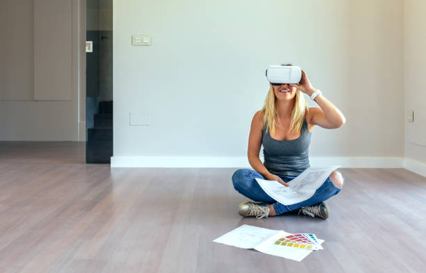 istock Woman watching with virtual reality glasses 864315624