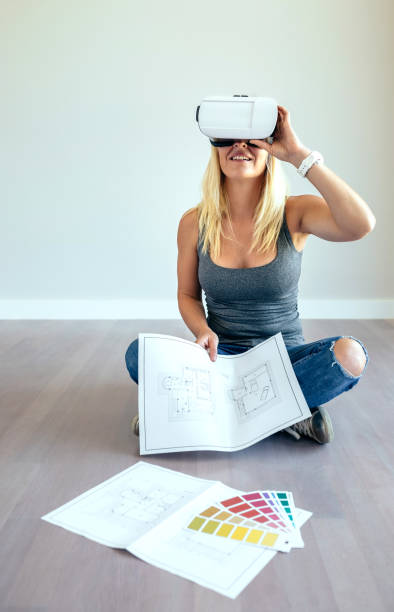 istock Woman watching with virtual reality glasses 864316968