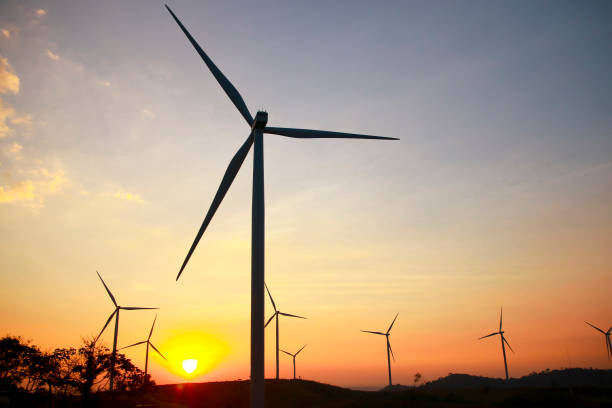 istock Stock Photo - Wind power at sunset 864319368