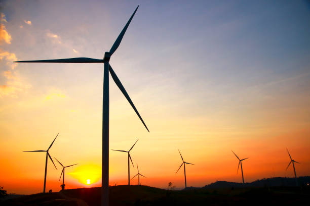 istock Stock Photo - Wind power at sunset 864319466