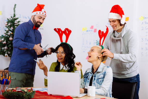 istock Colleagues celebrating Christmas in office during working hours 864325242
