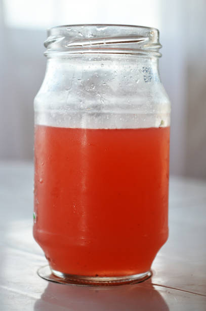 istock Strawberry juice in a glass jar 864334476