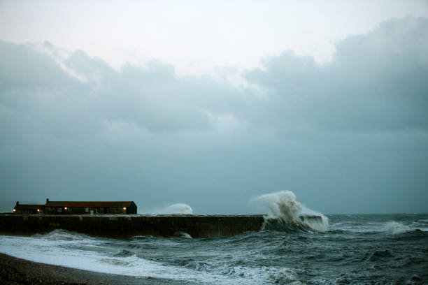 istock Stormy sea at the Cobb, Lyme Regis 864338004