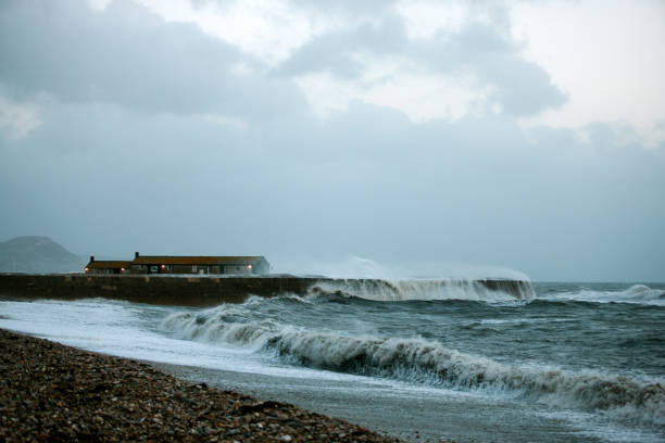 istock Stormy sea at the Cobb, Lyme Regis 864338272