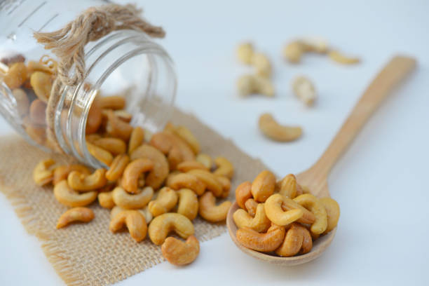 cashew nuts in wooden spoon