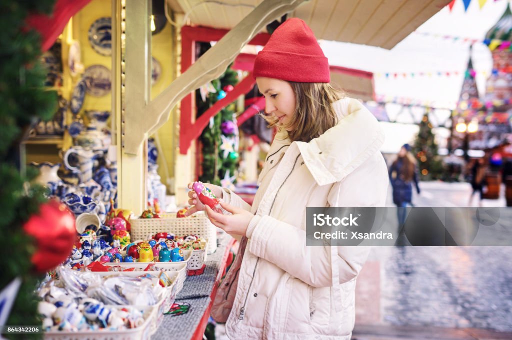 Woman shopping at Christmas market Winter shopping season Christmas Market Stock Photo