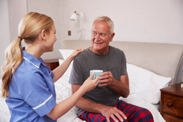 istock Nurse Making Home Visit To Senior Man In Bed 864342500
