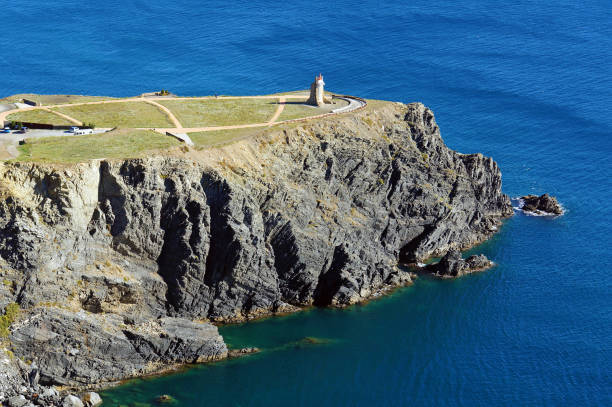 istock Cliff with a lighthouse in Mediterranean sea 864342788