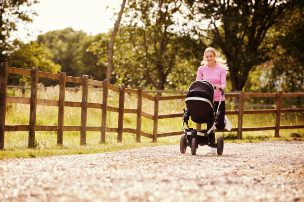 istock Mother Exercising By Running Whilst Pushing Baby Buggy 864347222
