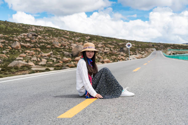 istock Women sitting on the road 864350168