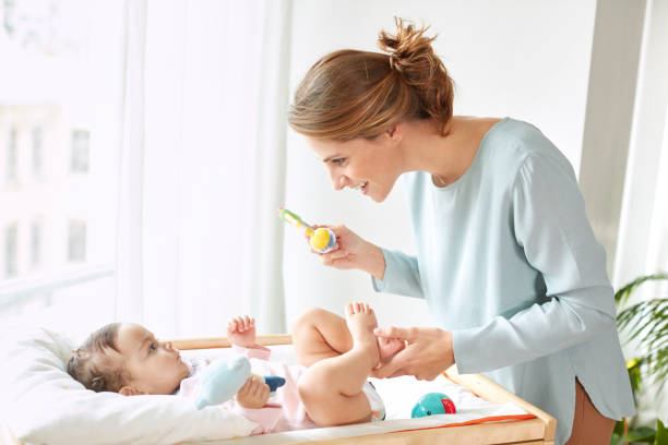 istock Mother playing with her baby 864351408