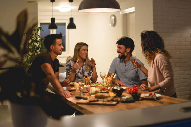 istock Friends at dinner party 864358244