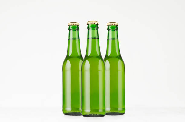 istock Group green longneck beer bottles 330ml, mock up. 864366842