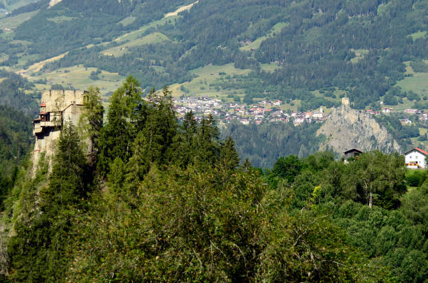 Kauns, Tirol, Austria - June 22, 2014. Medieval ruin Berneck in Kaunertal and mountain village Ladis with ruin Laudeck in background