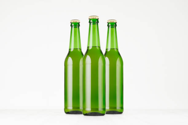 istock Group green longneck beer bottles 500ml, mock up. 864372418