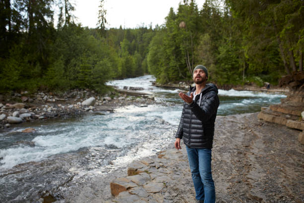 istock Man exploring wilderness area. Mountainous landscape 864374960