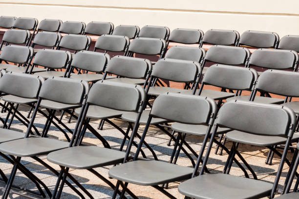 istock Chairs in rows before the concert. 864391112