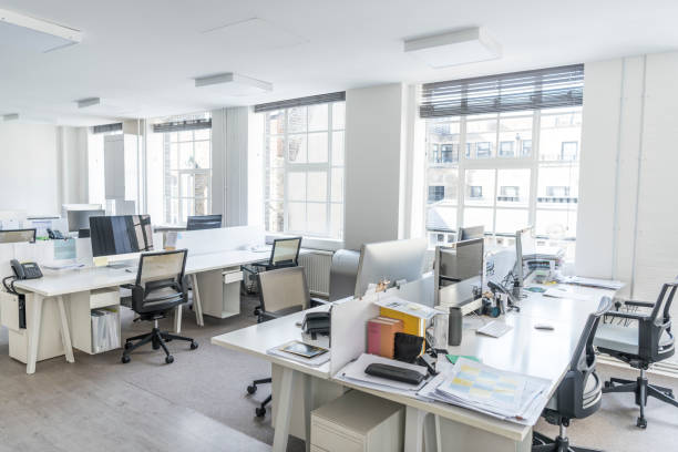 istock Tidy desks in contemporary office with natural light 864398624