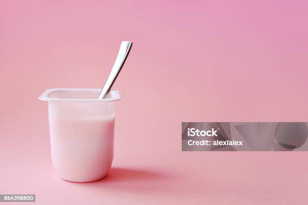 Strawberry Pink Yoghurt With Spoon In It Minimal Style Stock Photo - Download Image Now