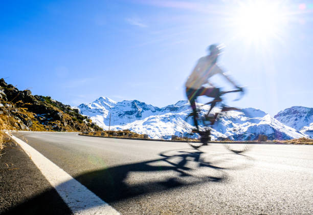 cyclist at the grossglockner mountain cyclist at the grossglockner mountain - blurred motion grossglockner stock pictures, royalty-free photos & images