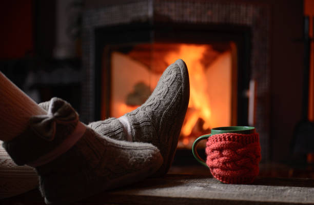 istock relaxing near fireplace 864405160