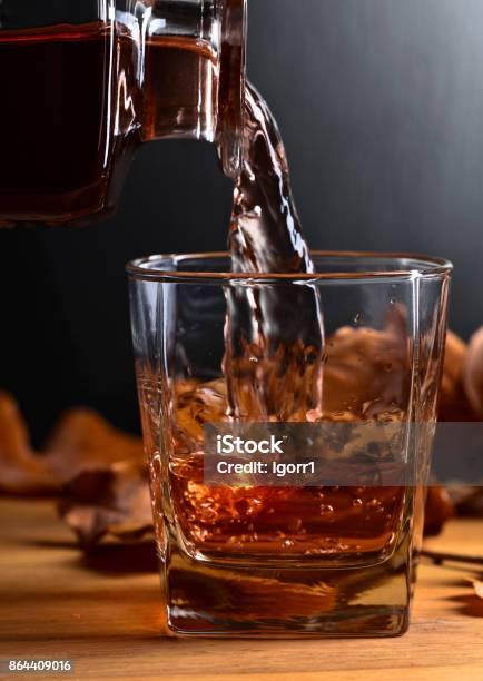 Whiskey On A Old Wooden Table Stock Photo - Download Image Now - Alcohol - Drink, Amber, Autumn