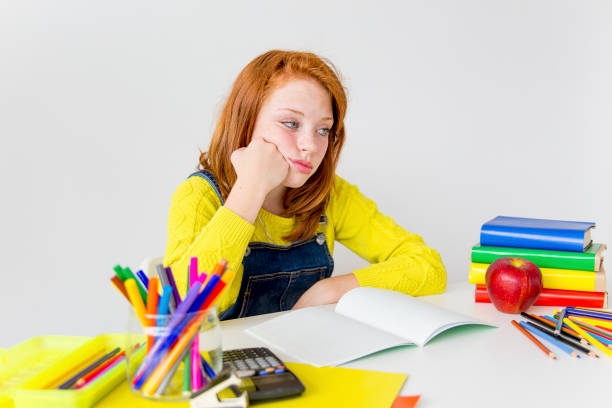Girl is studying Smart girl is sudying and doing her homework unproductive student stock pictures, royalty-free photos & images