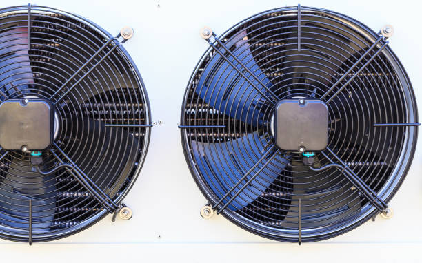 istock Closeup of black fan on white machine 864410216