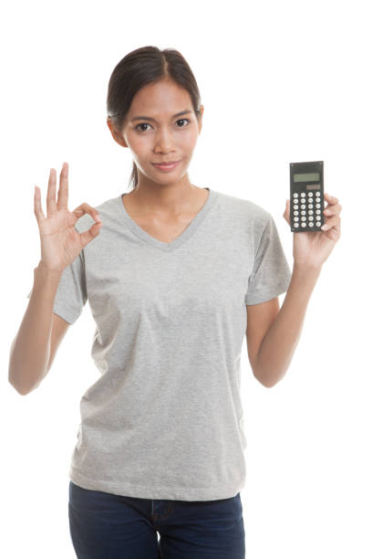 istock Asian woman show OK with calculator. 864410464