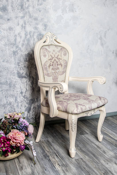 istock Old fashioned interior with luxury armchair on ocher wallpaper background 864411766