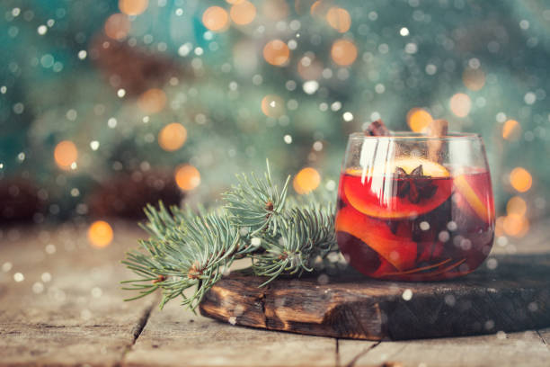 christmas hot mulled wine with cinnamon cardamom and anise on wooden background christmas hot mulled wine with cinnamon cardamom and anise on wooden background mulled wine photos stock pictures, royalty-free photos & images