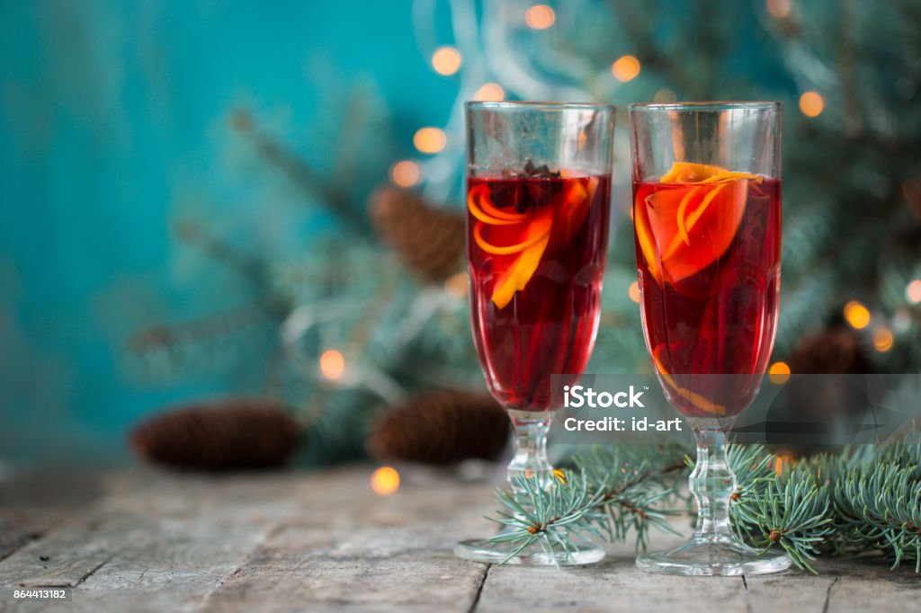christmas hot mulled wine with cinnamon cardamom and anise on wooden background Advent Stock Photo