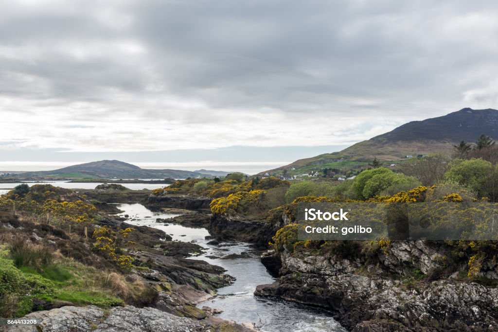 Nature landscape background showing a river under overcast sky with copy space The rural photo was photographed in Connemara, County Galway, Ireland. Connemara National Park Stock Photo