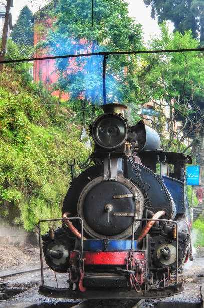 Steam engine train at Darjeeling West Bengal, India - April 4, 2012: Steam engine train of Darjeeling Himalaya railway at station in the morning darjeeling stock pictures, royalty-free photos & images