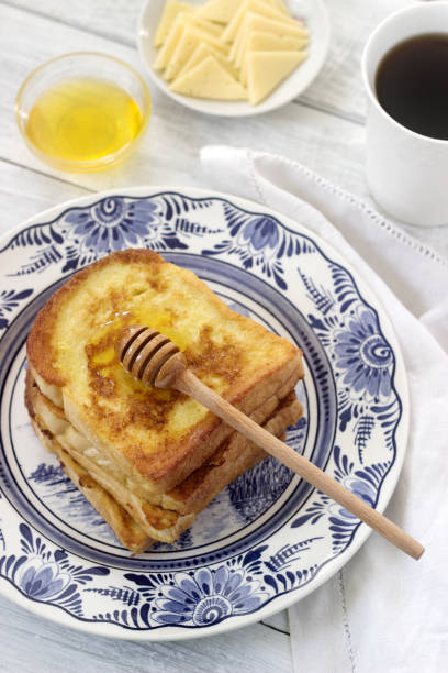 istock French toast served with honey and cheese. 864414632