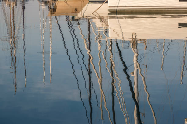 istock Reflection of yacht masts 864416368