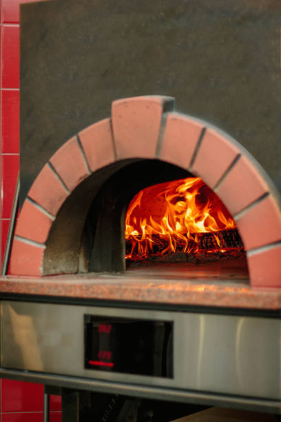 istock Fire flame in a traditional pizza oven. 864416466