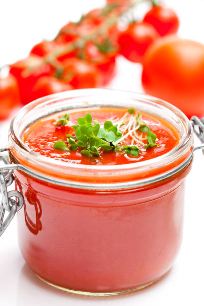 istock Glass  jar with tomato paste and cherry tomatoes isolated on white background 864417648