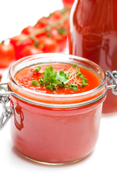 istock Glass  jar with tomato paste and cherry tomatoes isolated on white background 864417796
