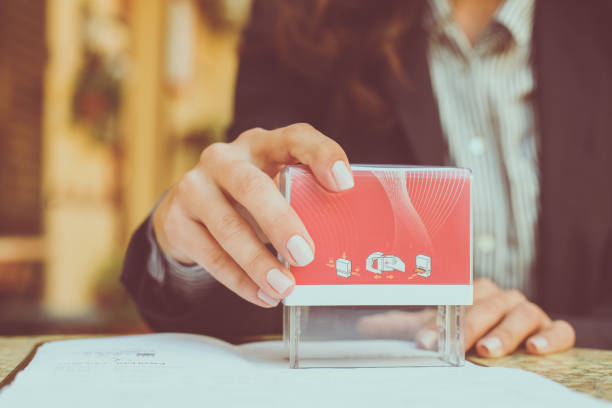 istock Business woman approve documents. Close up. 864419746