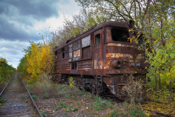Hopeless post apocalyptic landscape. Cemetery of abandoned broken trains.