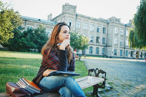 istock the student is sitting on the bench 864424776