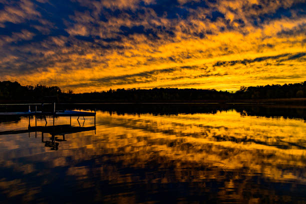 A beautiful sunset over a small lake in the lower peninsula of Michigan.
