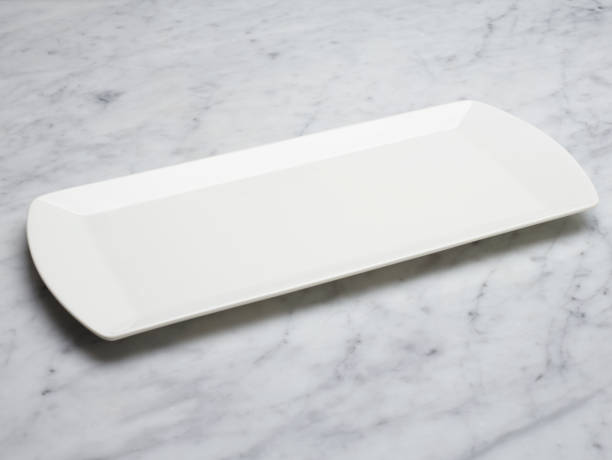 White Plate on Marble Table White Plate on Marble Table tray photos stock pictures, royalty-free photos & images