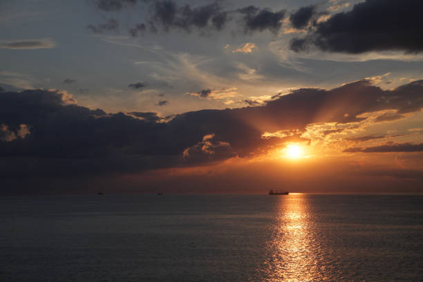 istock Moody sunset over ocean 864429498