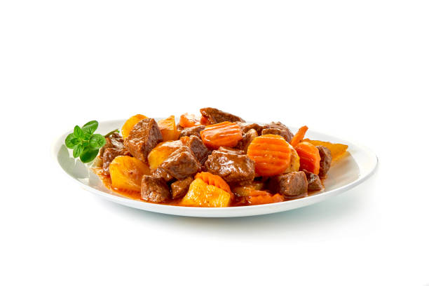 istock Stew Meat with carrots isolated on white background 864431356