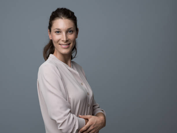 istock Smiling young woman portrait 864431704